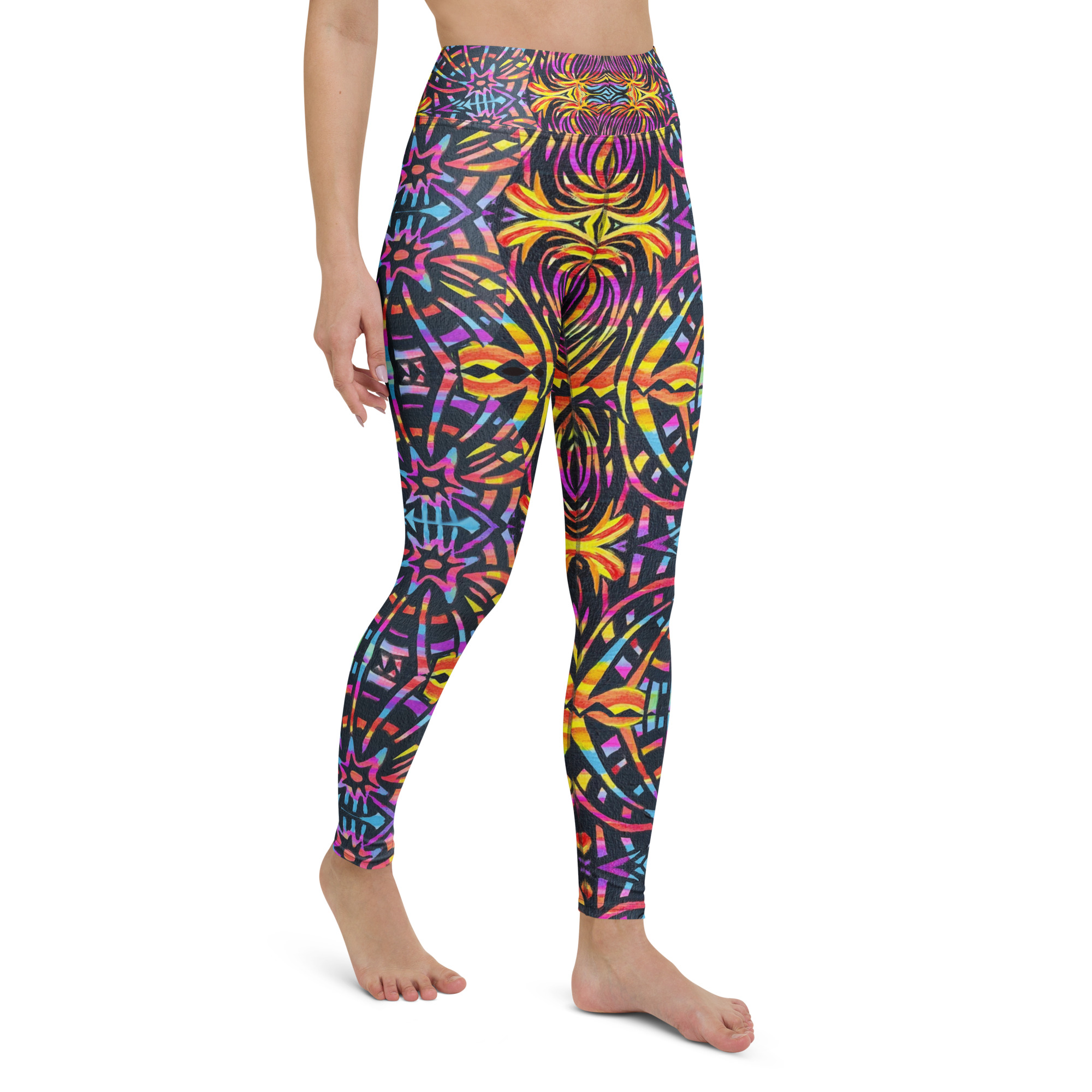 Model wears BoomBoom Yoga pants with baseball cap and black blouse. Model stands out against the mountain backdrop with the BoomBoom yoga leggings striking bold colourful patterns.