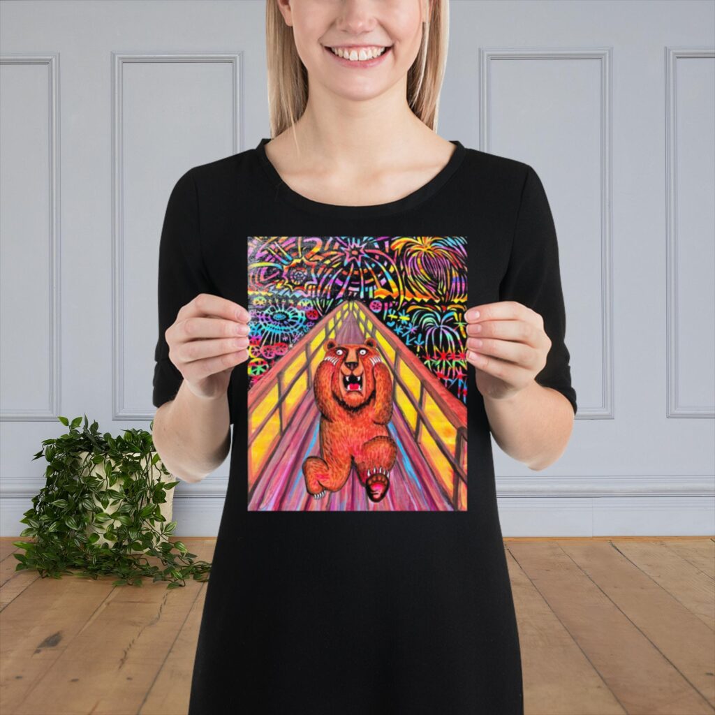 a happy teenager holds a copy of Bear Scream size is 8 x 10 inches. Bear Scream is inspired by Edward Munch's Scream. Fireworks are behind the Bear as he holds his face : Scared.