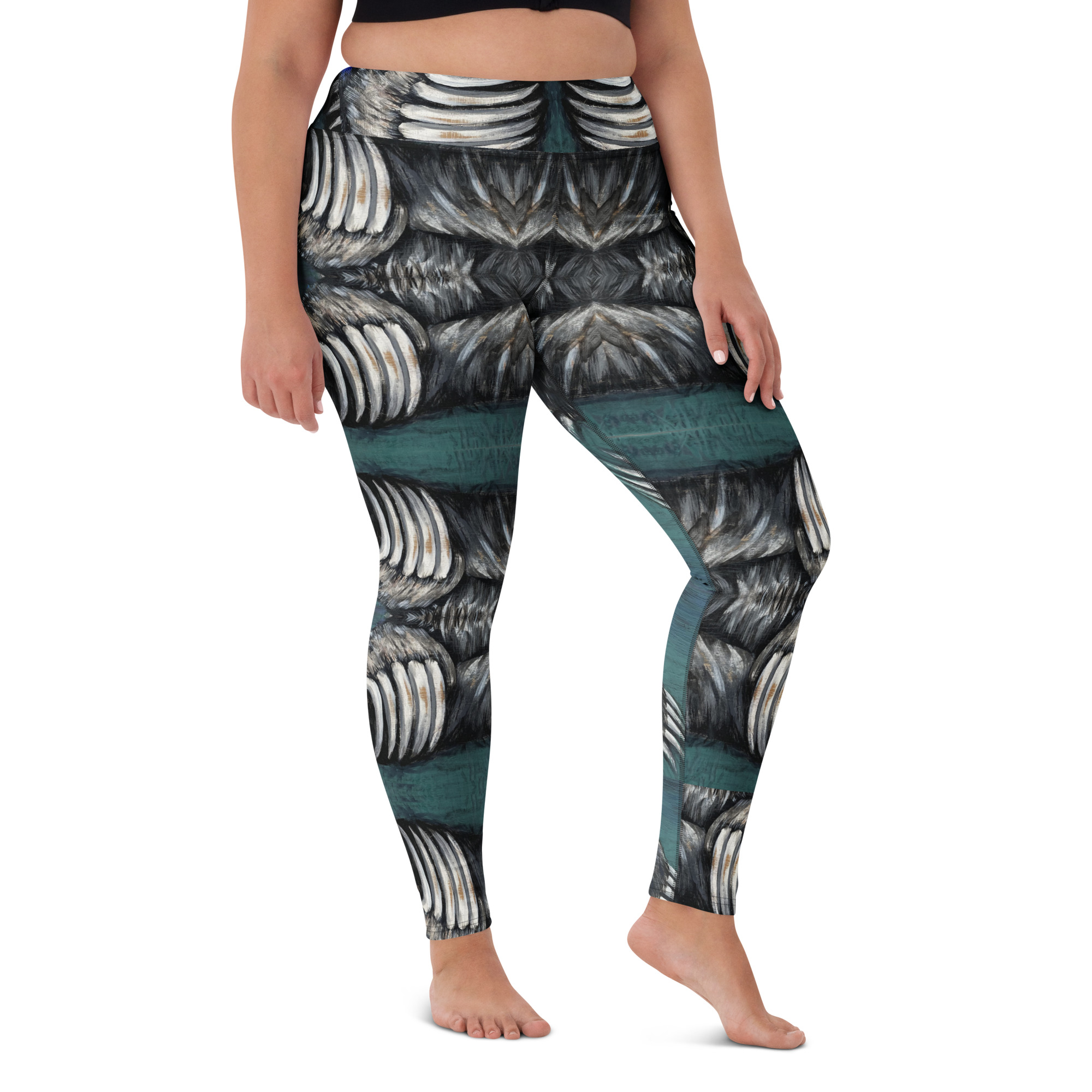 A woman in high waist with a wide waist band yoga leggings. White and black bear claws on a deep green background create a mirror pattern with 360 degrees of fashion designed by Tanya Tee Art_TLC.