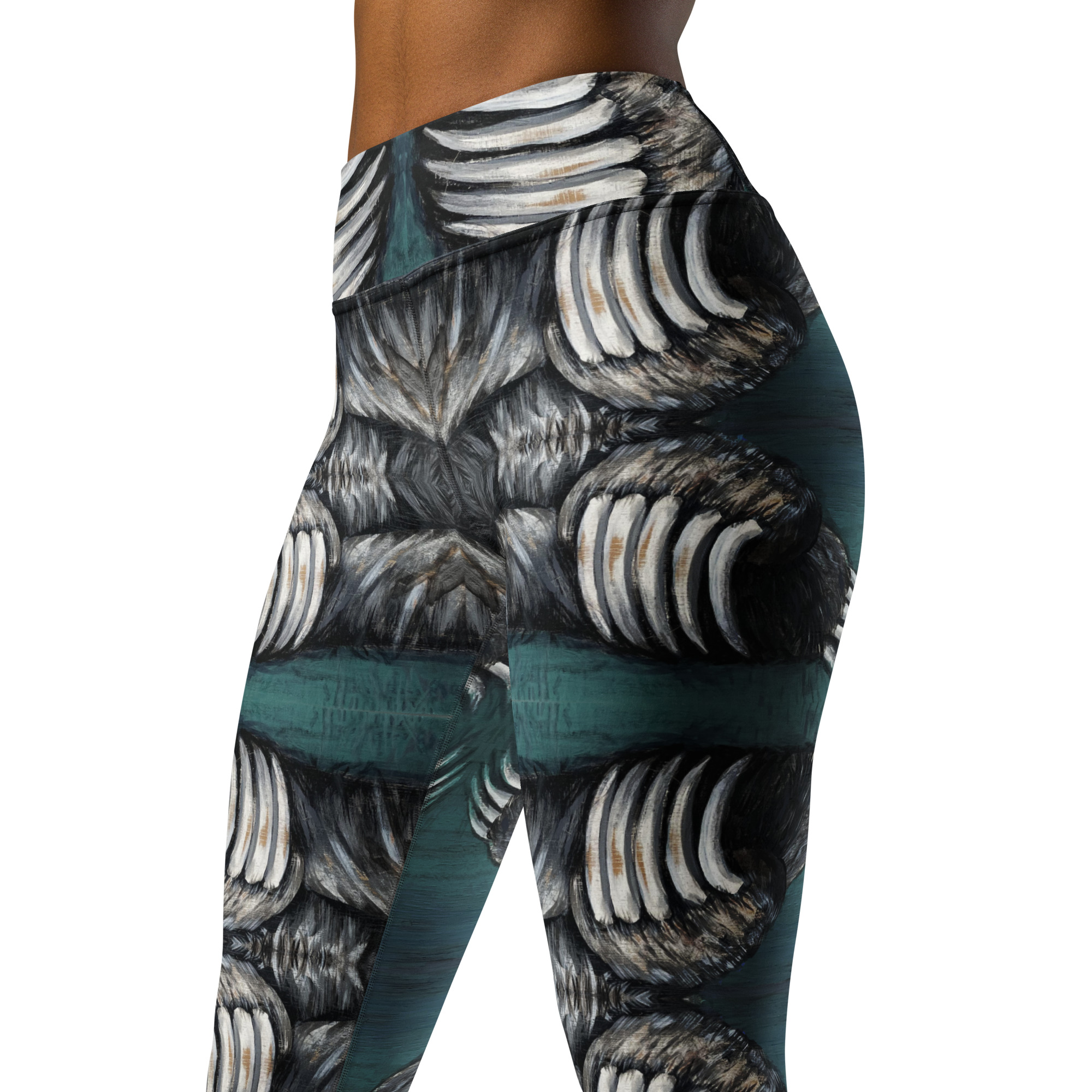 A woman in high waist with a wide waist band yoga leggings. White and black bear claws on a deep green background create a mirror pattern with 360 degrees of fashion designed by Tanya Tee Art_TLC.