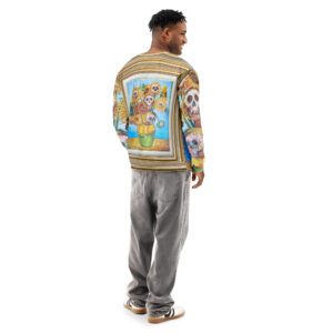 Man stand with his back on display, showing gold frames surrounding a painting of Sunflowers & Skulls in yellow, orange, brown, green, and blue, with white and black skulls delicately painted into the flower heads.