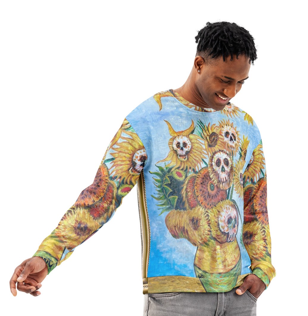 Model wearing the Sunflowers n Skulls Sweatshirt by Tanya Tee Art_TLC, featuring a bold sunflower‑and‑skull print on a cozy unisex fit.