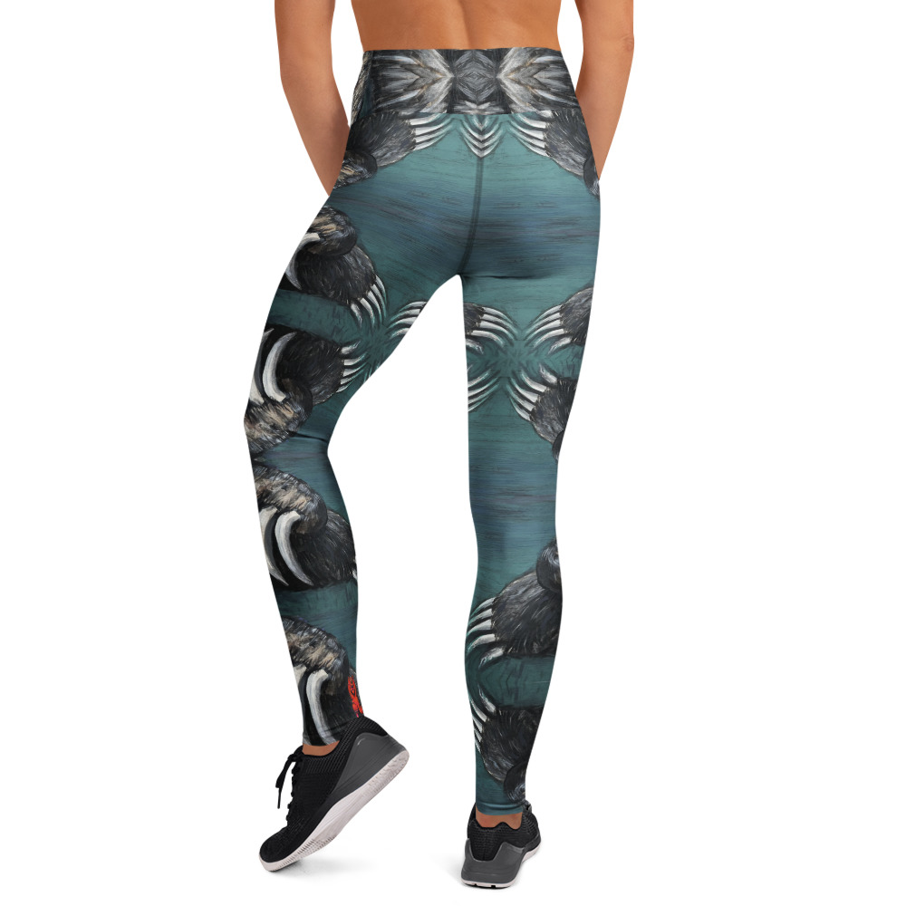 A woman in high waist with a wide waist band yoga leggings. White and black bear claws on a deep green background create a mirror pattern with 360 degrees of fashion designed by Tanya Tee Art_TLC.